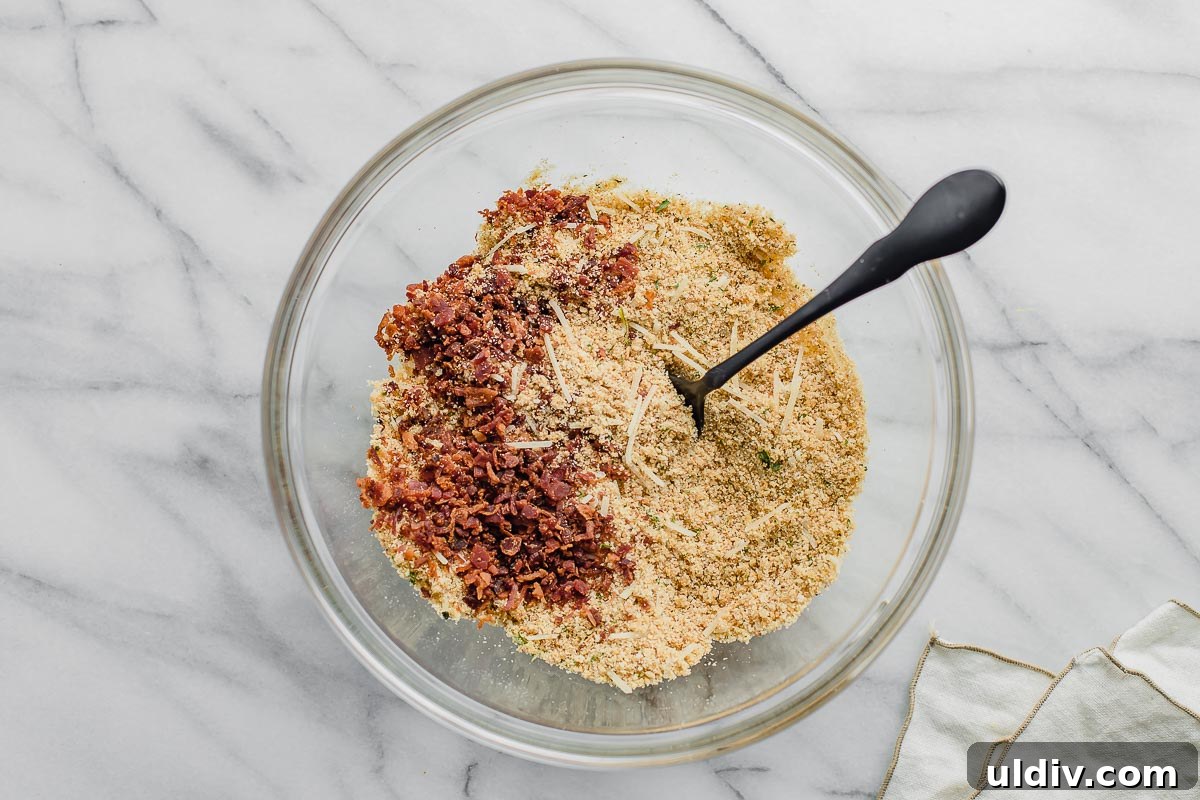 Creamy Lobster Macaroni and Cheese with Parmesan Crust 4 Breadcrumb topping in a bowl.