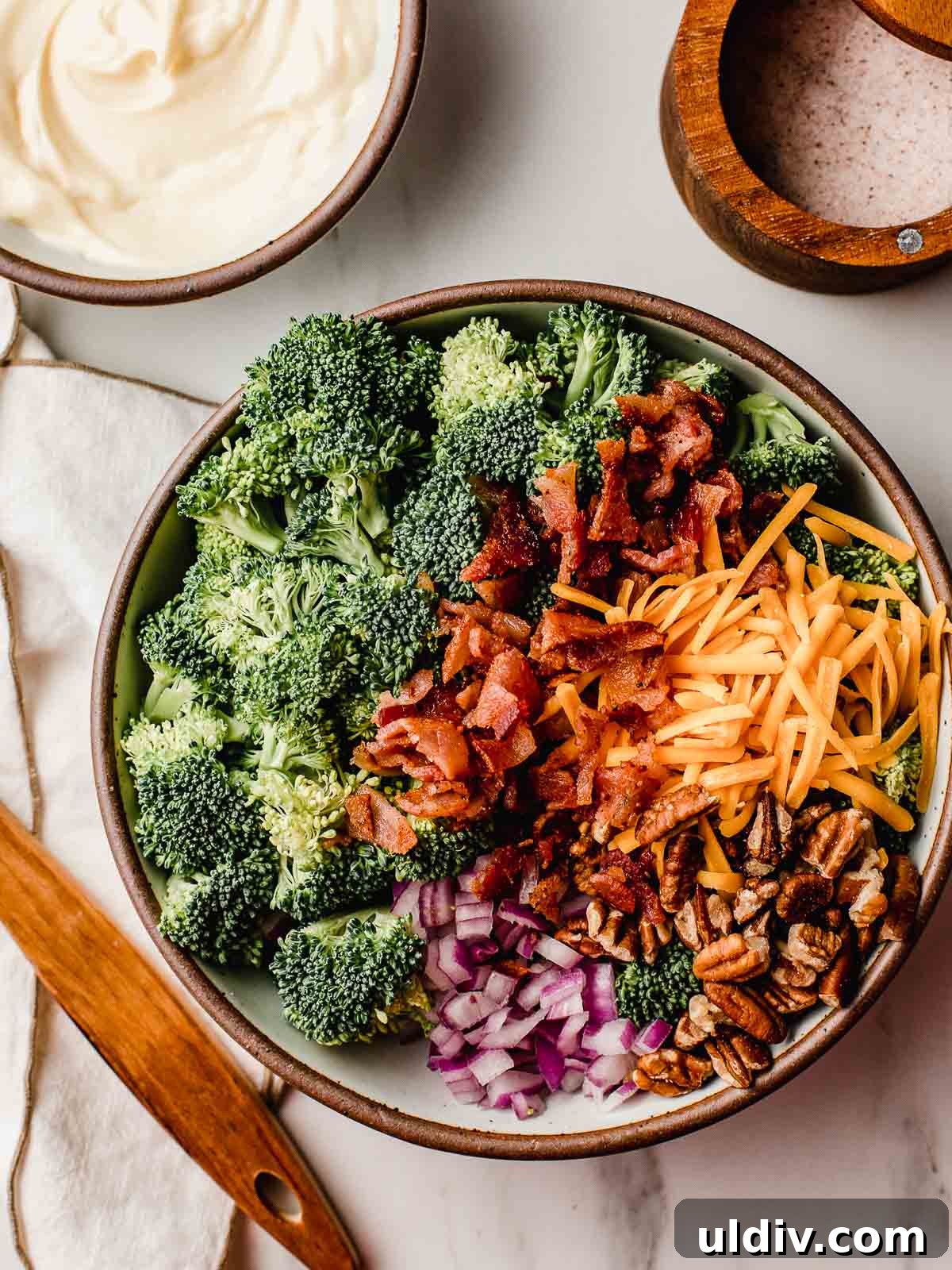 Keto Broccoli Salad with Bacon, Cheddar & Creamy Dressing 4 Broccoli salad ingredients on a table.