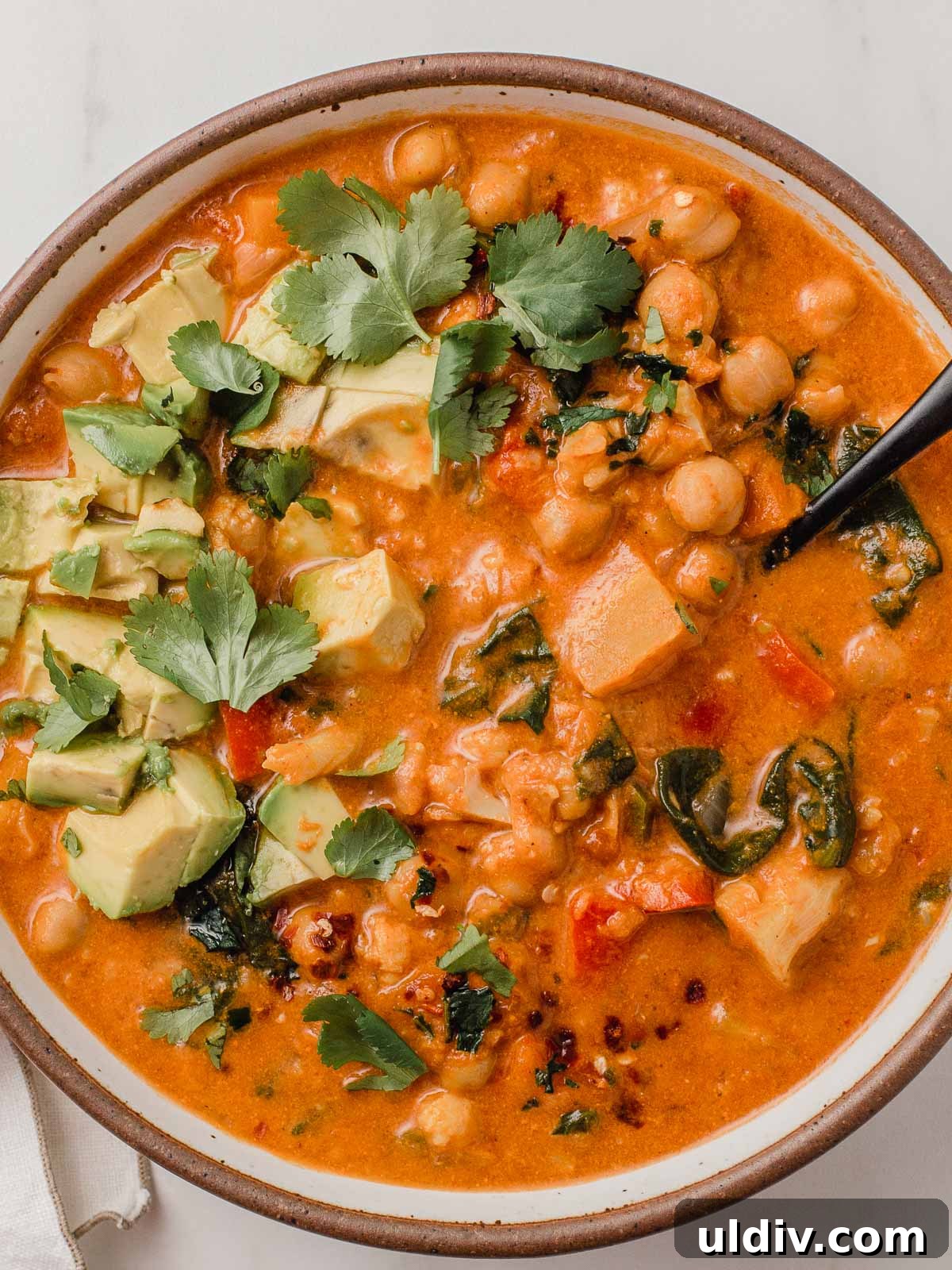 Instant Pot Chickpea Curry Recipe — Quick Weeknight Dinner 2 Chickpea cauliflower curry in a bowl.