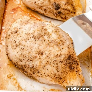 Juicy Oven-Baked Chicken Breasts with Garlic and Herbs 8 Baked chicken breast in a pan.