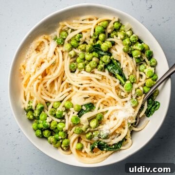 Creamy Parmesan Pasta with Sweet Peas: Quick Weeknight Recipe 4 Pasta with Peas, parmesan and lemon in a bowl.