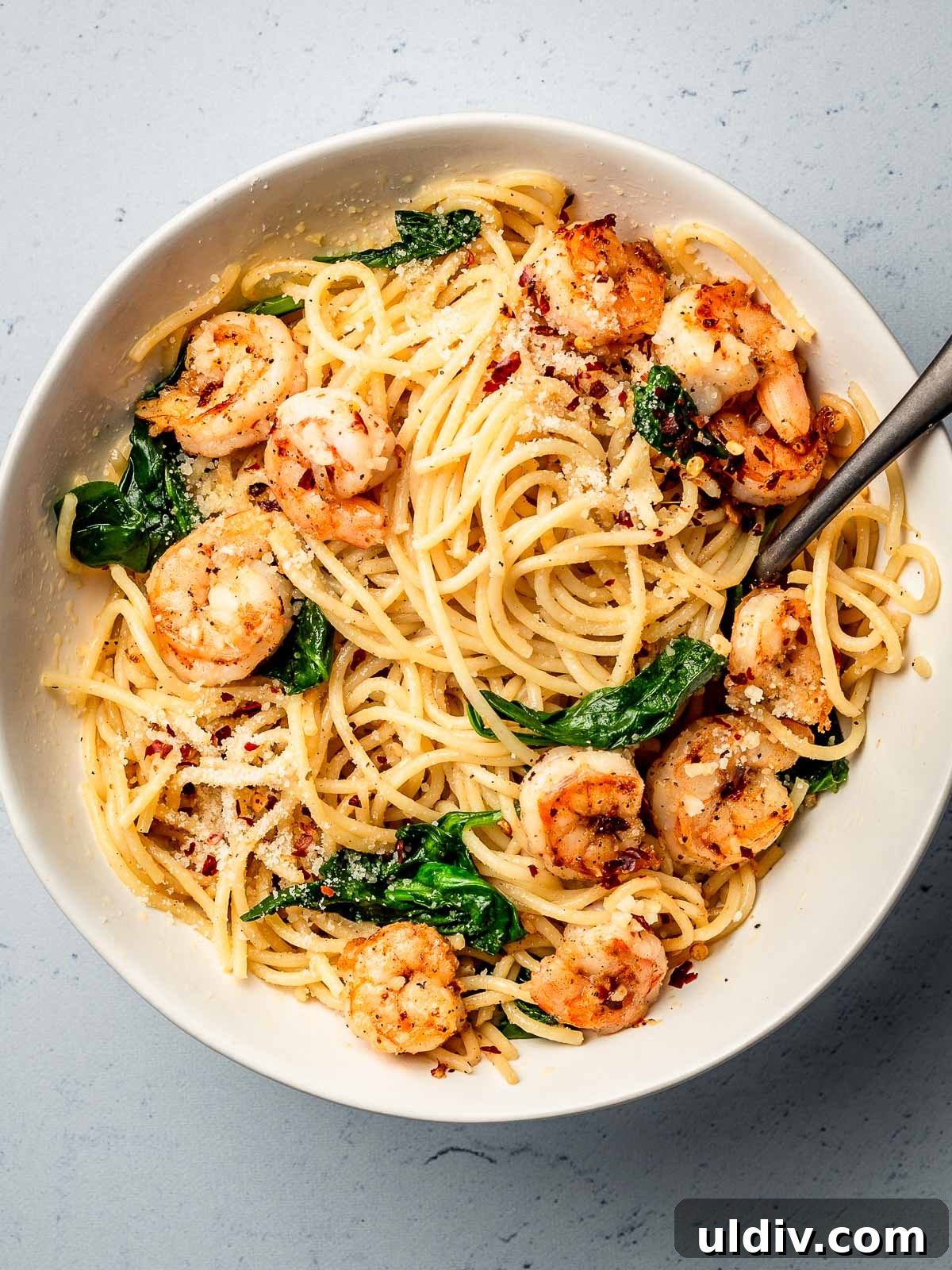 Garlic Butter Shrimp Pasta Recipe with Lemon and Parsley 2 Pasta with garlic butter shrimp in a bowl.
