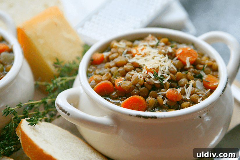 Hearty Homemade Lentil Soup Recipe for Comforting Weeknight Meals 5 Lentil soup with grated cheese on top.
