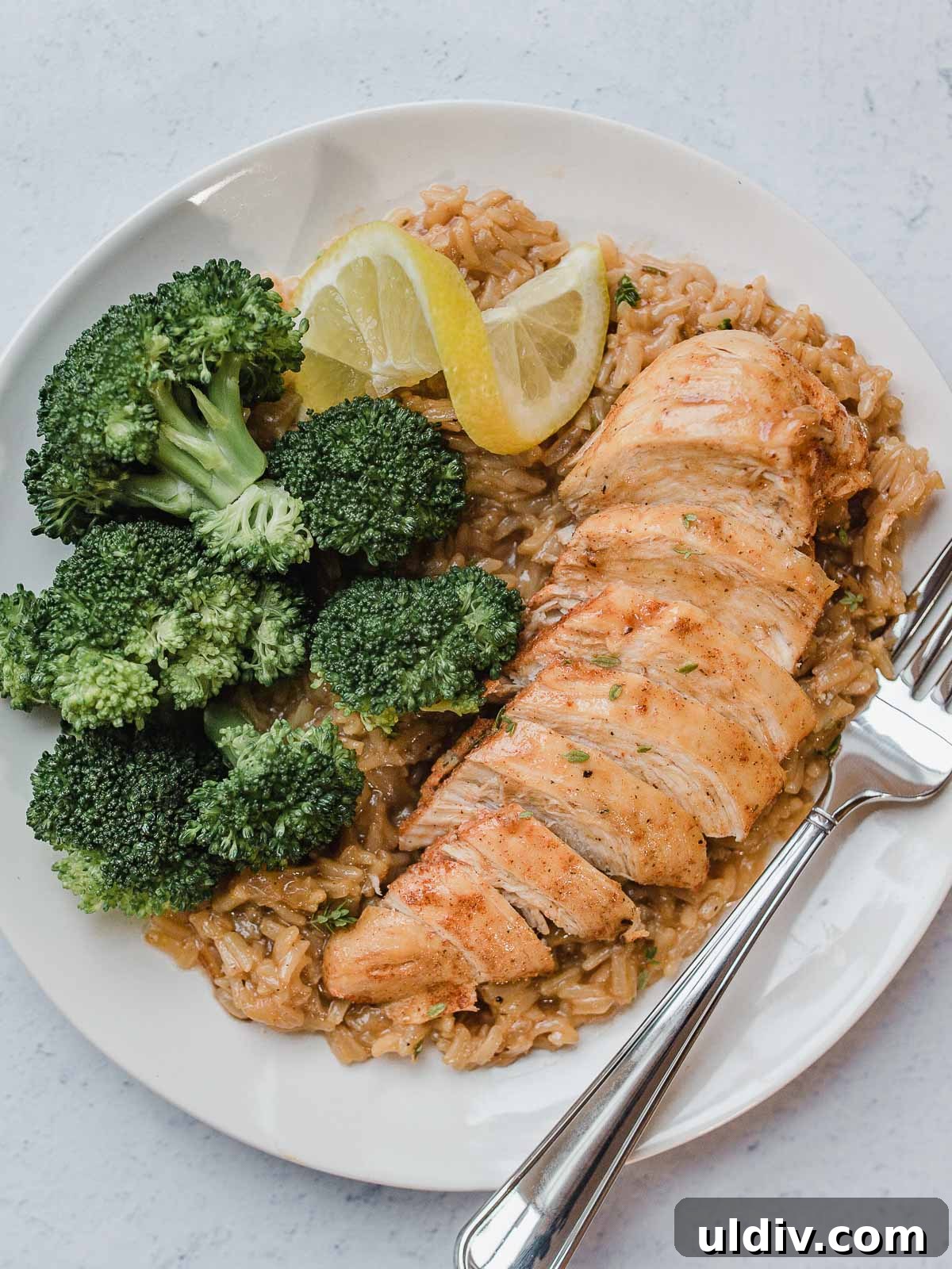 Instant Pot Lemon Herb Chicken with Flavorful Rice 2 IP Lemon Herb Chicken and Rice on a plate with broccoli.
