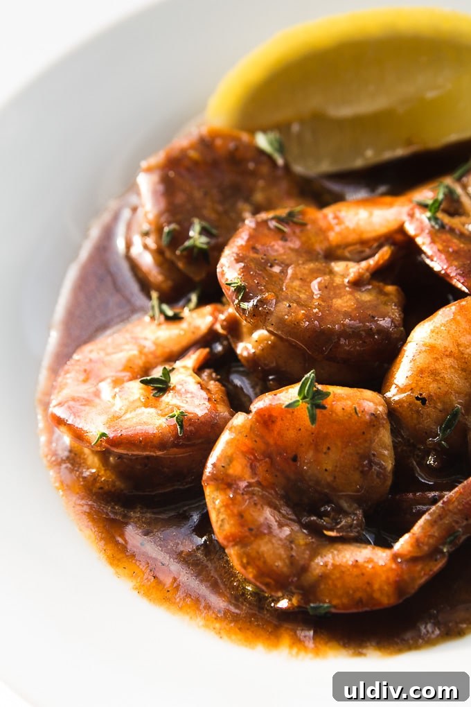 No need to break out the grill, these New Orleans BBQ Shrimp on cooked on the stove top. Juicy succulent shrimp in a buttery lemon Worcestershire sauce. New Orleans BBQ Shrimp on a serving platter