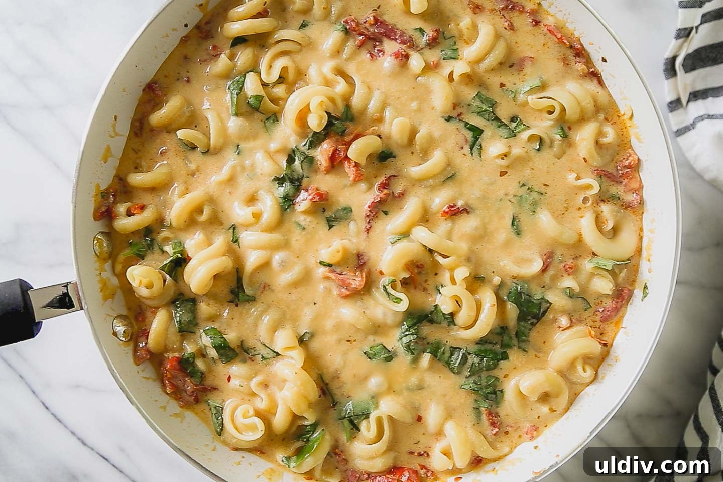 Creamy Sun-Dried Tomato & Basil Pasta Recipe for Dinner 2 Sun-dried tomato and basil pasta in a skillet.