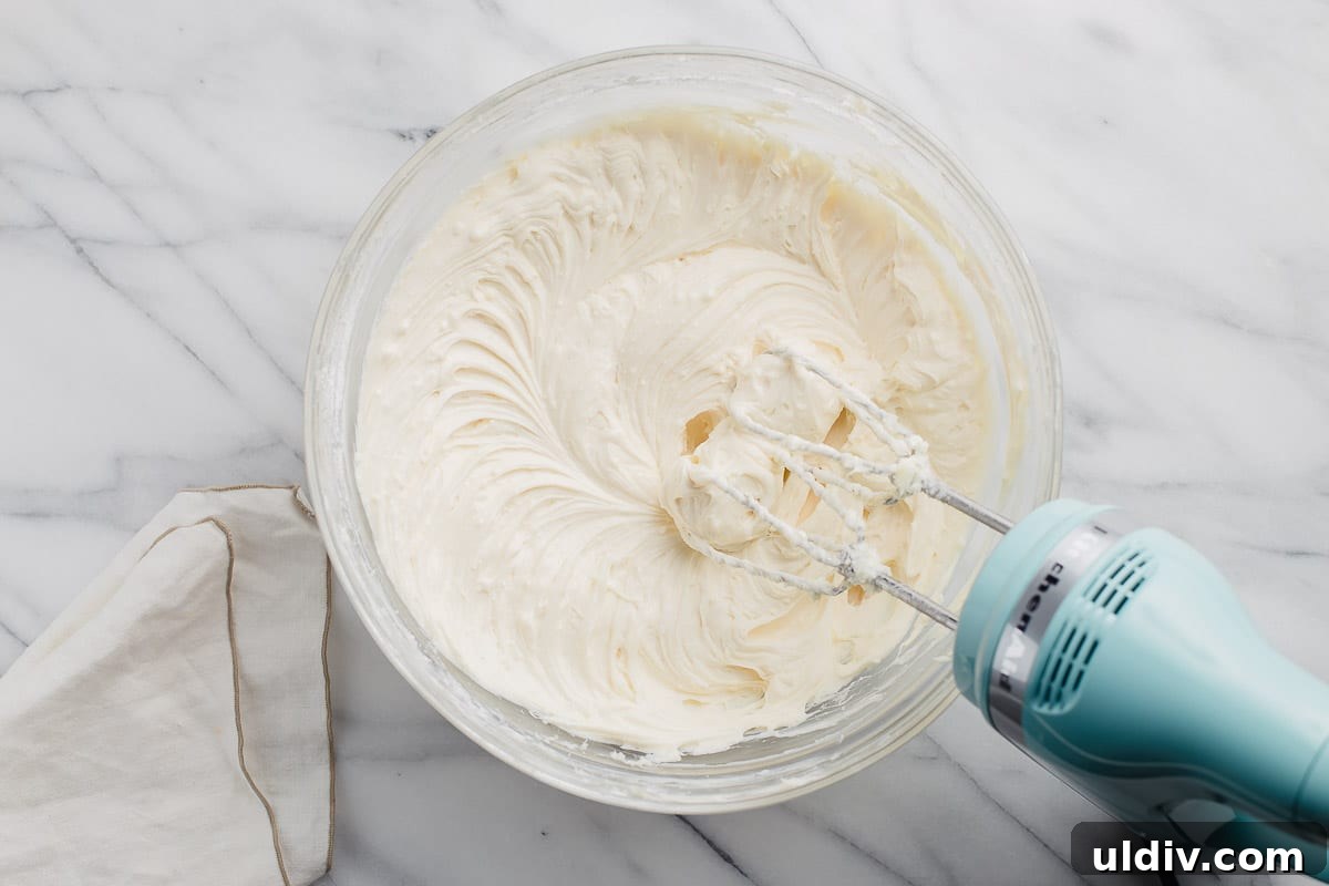 Classic Creamy Cheesecake Recipe for Perfect Results 4 Easy cheesecake filling in a mixing bowl.
