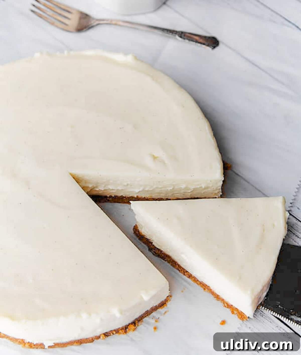 Classic Creamy Cheesecake Recipe for Perfect Results 5 A cheesecake resting on the counter.